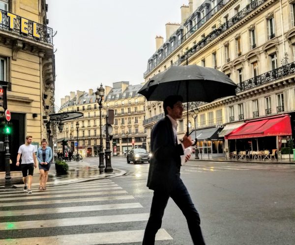 Street Shot from Cafe Man with Umbrella Paris
